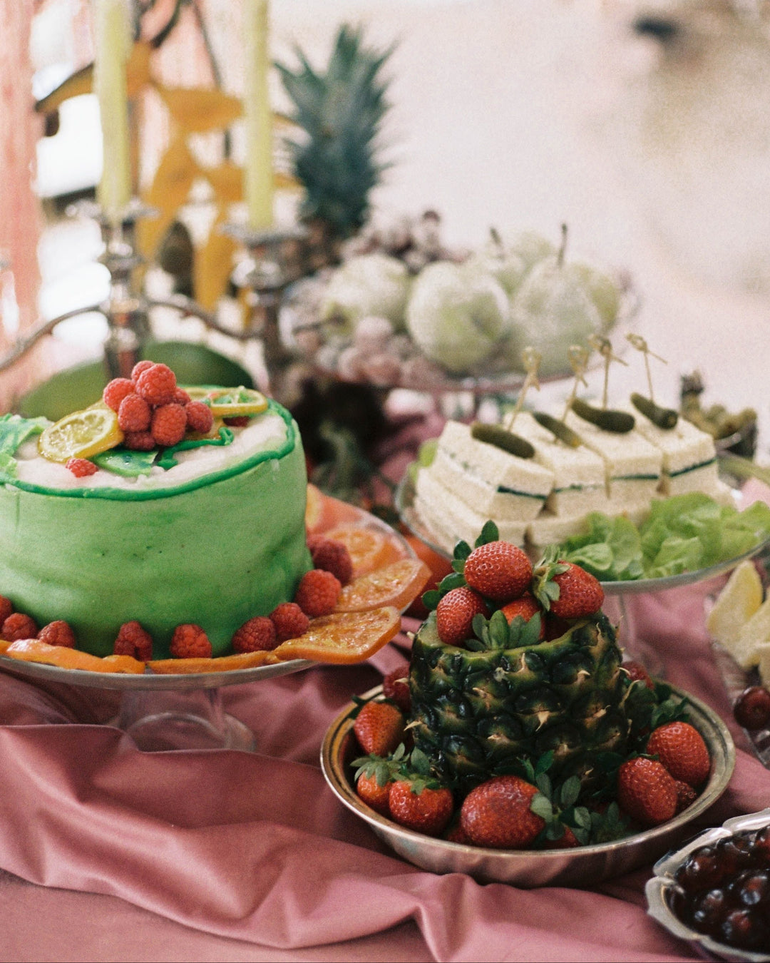 Decorative cake and dessert display on a table.