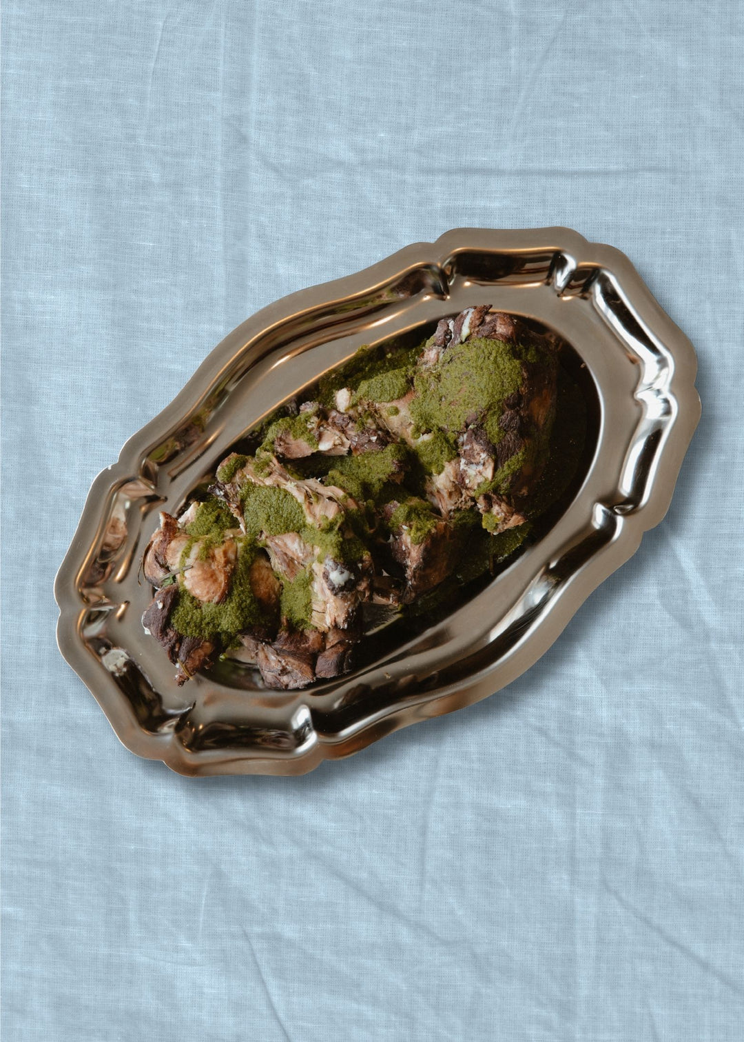 A plate of Braised Lamb Shoulder with Salsa Verde